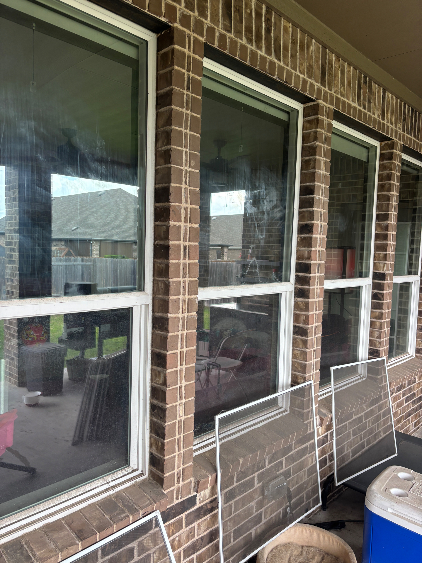 Windows with dirt and water marks before cleaning